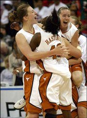 Texas' Heather Schreiber, left, Annissa Hastings (43) and Jamie
Carey, right, celebrate their Big 12 Conference tournament title.
The fifth-ranked Longhorns held off No. 8 Texas Tech, 67-57, in the
championship game Saturday night in Dallas.