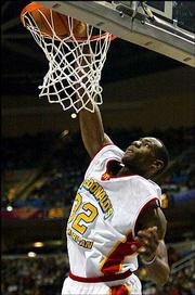 Akron St. Vincent-St. Mary's LeBron James goes up for a dunk in the
first half of the McDonald's All-American Game. James had 27 points
in the East's 122-107 victory Wednesday at Gund Arena in Cleveland.