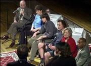 School bond panelists, from top left, Supt. Randy Weseman, Laura
Denneler, Caleb Powers, Ed Tato, Judy Wright and James Hilliard
discuss issues dealing with the proposed bond issue during a
meeting at Liberty Hall. The televised forum Wednesday night was
sponsored by The World Company, which owns the Journal-World,
Sunflower Broadband and World Online.