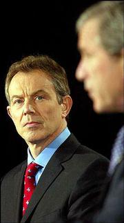 President Bush, right, and British Prime Minister Tony Blair face
reporters after their overnight war summit at Camp David, the
presidential retreat 70 miles north of Washington in Maryland&squot;s
Catoctin Mountains. When asked Thursday about the war&squot;s length, the
president said, "This isn&squot;t a matter of timetable, it&squot;s a matter of
victory. And the Iraqi people have got to know that, see. They got
to know that they will be liberated and Saddam Hussein will be
removed, no matter how long it takes."