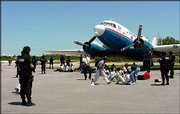 Members of the Monroe County SWAT team surround the passengers and
crew of a hijacked Cubana Airlines plane at the Monroe County
Airport in Key West, Fla. Thirty-two passengers and crew landed
safely in Key West after their plane was hijacked Monday leaving
the Isle of Youth, Cuba. The alleged hijacker was taken into
custody.