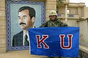 As U.S. forces advanced on the Iraqi capital of Baghdad, fraternity
brothers and friends of Capt. Brad Loudon, a 1997 Kansas University
graduate, were circulating this photo of Loudon that they found in
their email inboxes along with a message from him early Friday
morning.