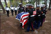 U.S. Marines carry the casket of U.S. Marine Lance Cpl. Brian
Buesing, who was killed in fighting in Iraq. Buesing's funeral was
Saturday in Cedar Key, Fla.