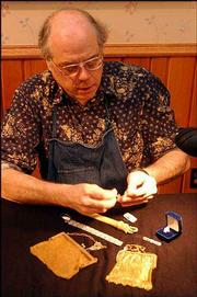 Peter Zacharias, owner of Goldmakers, 723 Mass., is an expert on
vintage jewelry. He'll share his knowledge on Wednesday at Watkins
Community Museum of History's April session of Know Your Antiques.
