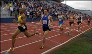Kansas University graduate Charlie Gruber, third from left,
prepares to make his move during the final lap of the men's
1,600-meter race. Gruber defeated standout runner Alan Webb (not
pictured) in the event Saturday during the Kansas Relays at
Memorial Stadium.