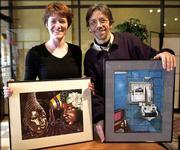 Findlay High School art teacher Valerie Devitt, left, and artist
Philip Sugden hold art works by Lima Correctional Institution
inmates, on display at a Findlay, Ohio, coffee house. The works are
Charles Hester&squot;s "Ladies Day," left, and Willie Hightower&squot;s "A
10,950 Day View."