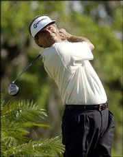 Fred Couples hits his tee shot on the 18th hole during the final
round of the Houston Open. Couples, who won Sunday at Redstone Golf
Club in Humble, Texas, is looking more like a player capable of
winning another major.