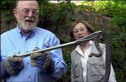 Wildlife experts Joe and Suzanne Collins display a massasauga, a
small rattlesnake, that they found early Saturday in southwest
Douglas County. The snake is believed to be the first massasauga
found living in Douglas County.