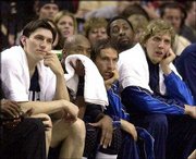 Dallas players, from left, Eduardo Najera, Nick Van Exel, Steve
Nash and Dirk Nowitzki watch as the Mavericks lose Game 4 of their
first-round series to the Trail Blazers in Portland, Ore. Dallas is
on the brink of making history: becoming the first NBA team to blow
a 3-0 lead in the playoffs.