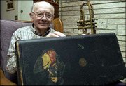 Lester Marsh, 80, of Lawrence, has had a Jayhawk sticker on his
trumpet case for more than 50 years. Marsh hasn't played the
trumpet much since his days in the Army, but he remembers carrying
it through his service in World War II.