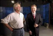 Bob Schulte, Lawrence, left, and former Lawrence resident Mike
Jarrick, co-anchor on the Fox News Channel morning show "Fox and
Friends," visit during a promotional taping for Lawrence&squot;s 6News.
Jarrick stopped in Lawrence last week.