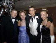 From left, William Haney, Free State High School senior; Kristen
Stetler, Lawrence High School senior; Brandon Butler, Lawrence, and
Cassie Strickland, LHS senior, pose for a picture during the LHS
prom. The theme of the May 10 event was "Evening Among the Stars."
It was in the Kansas Union Ballroom.