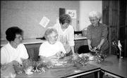 Ruth Riggens, Margaret Anderson, Melanie Nolker and Joyce Witulski
work on table favors for the Douglas County Senior Center's Spring
Tea and Fashion Show. The center's benefit event is today.