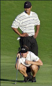 Annika Sorenstam, bottom, and Tiger woods line up her putt on the
eighth hole during the "Battle at Bighorn," a one-round,
alternate-shot match featuring Sorenstam and Woods against Karrie
Webb and David Duval at the Bighorn Golf Club in Palm Desert,
Calif., in this July 30, 2001 photo.