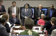 Singer James Brown, standing center, appears before the Department
of Probation, Parole and Pardon Services board in Columbia, S.C.
The seven-member board on Tuesday granted Brown a pardon for crimes
he committed in 1988 and 1998.