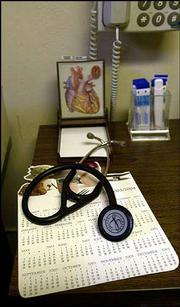 A corner of a desk in one of the examining rooms in Dr. Stevens'
office. Stevens' abilities to diagnose accurately are well-known
among his patients.