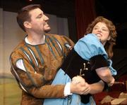 MPetrucchio, portrayed by Curtis Marsh, struggles with Kate, played
by Sarah Young, in a scene from "Kiss Me Kate." The Cole Porter
musical opens Friday and runs through June 22 at the Lawrence
Community Theatre, 1501 N.H.