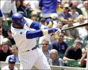 Chicago's Sammy Sosa delivers a run-scoring single in the first
inning. Sosa and the Cubs defeated Tampa Bay, 8-1, Thursday in
Chicago.