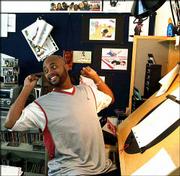 Animator Bruce Smith, executive producer and creator of the Disney
Channel&squot;s "The Proud Family," stretches at his drawing desk at his
studio in Glendale, Calif. "The Proud Family" is an animated sitcom
that follows the adventures of Penny Proud, a 14-year-old
African-American girl, and her family.