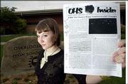Lacey Hanson, a recent Oskaloosa High School graduate, was at the
center of a censorship controversy involving her school paper and
the school's principal. Hanson, who will study broadcast journalism
next fall at the University of Missouri, is shown outside the
school holding the version of the paper edited by the principal.