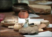 Looted artifacts are seen on a table at the Iraqi National Museum
in Baghdad, Iraq, in this May 6 file photo, after they were
recovered. The world-famous treasures of Nimrud, unaccounted for
since Baghdad fell two months ago, have been found in good
condition in the Central Bank, in a secret vault-inside-a-vault,
submerged in sewage water.