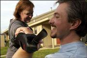 White Dragon Kung Fu instructor Steve Carrier brushes off a
prop-knife attack from student Laura Cuthbertson.