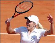 Belgium's Justine Henin-Hardenne reacts after defeating compatriot
Kim Clijsters. Henin-Hardenne won, 6-0, 6-4, in the women's final
of the French Open tennis tournament Saturday at Roland Garros
stadium in Paris.