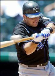 Kansas City's Mike Sweeney connects for a grand slam. Sweeney's
homer came in the first game of a doubleheader Saturday against
Colorado in Denver. The Royals won the first game, 13-11, and the
second game, 9-5.
