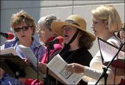 St. Margaret&squot;s Episcopal Church members Jeanne Williams, Ann Haley,
Judith deChamplain and Kirsten Irons sing "Old Time Religion" at an
outdoor service. St. Margaret&squot;s averages approximately 500
parishioners at its four Sunday services.