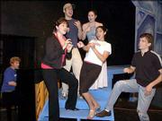 The cast of Rodgers and Hammerstein&squot;s "A Grand Night for Singing"
performs a number from their upcoming musical. Pictured are, from
left, musical director Michael D. Johnson, Kelli Berry, Dylan
Hilpman, Julia Hardin, Michelle Nikoomanesh and Evan Grosshans. The
University Theatre production opens at 7:30 p.m. Friday in the Inge
Theatre at Kansas University.