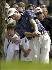 Jim Furyk hits out of the rough on the first hole en route to a
third-round score of 67. Furyk, at 10 under Saturday, will carry a
three-stroke lead into today's final round of the U.S. Open in
Olympia Fields, Ill.
