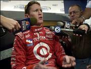 Indy Racing League driver Scott Dixon answers questions following
practice at the Kansas Speedway in Kansas City Kan.