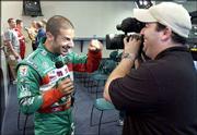 Indy Racing League driver Tony Kanaan horses around for a TV crew.
A handful of racers tested cars Tuesday at Kansas Speedway in
Kansas City, Kan.