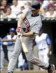Minnesota's Corey Koskie strokes a two-run home run in the fifth
inning. Koskie had two home runs and six RBIs, leading the Twins to
a 16-2 victory over the Royals Thursday in Kansas City, Mo.