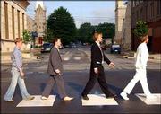 Lawrence&squot;s hardaways re-create the famous 1969 album cover to The
Beatles&squot; "Abbey Road" in front of The Replay Lounge at 10th and
Mass.