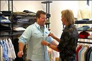 Andrew Lane, left, has his shirt adjusted by Carson Kressley in a
scene from Bravo&squot;s new series "Queer Eye for the Straight Guy." The
series, in which style-challenged straight men are overhauled by
experts whose credentials include being gay, premieres Tuesday.