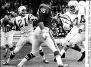 Former Kansas University standout John Hadl (21) heaves a pass as
quarterback of the San Diego Chargers in this file photo. With the
Chargers, Hadl played behind Jack Kemp, who became a politician and
will attend the Dole Institute of Politics opening celebration next
week.