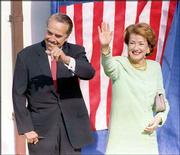 Bob and Elizabeth Dole wave to supporters after voting at Russell's
First Christian Church on Election Day in 1996. Bob Dole was atop
the Republican Party ticket, running for president against
Democratic incumbent Bill Clinton.