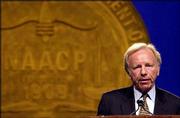 Presidential candidate Sen. Joseph Lieberman, D-Conn., is speaking
a bit more harshly about his Democratic opponents and President
Bush. He's shown here speaking Thursday at the NAACP convention in
Miami.