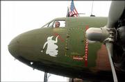 John Green, of Shawnee, gets ready to give an AC-47 Gunship a test
flight. Green and other pilots are at the Lawrence Municipal
Airport with their vintage aircraft as part of the dedication
ceremonies for the Dole Institute of Politics at Kansas University.
He sat in the cockpit of the plane Saturday.
