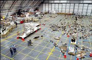 Wreckage of the space shuttle Columbia sits on the floor of a
hangar at the Kennedy Space Center in Cape Canaveral, Fla., in this
May 22 file photo. NASA officials are seeking advice about what to
do with the 84,000 shattered pieces from Columbia, according to
reports Sunday.