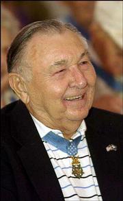 Charles Murray Jr. enjoys himself during the Memory Tent panel
feting Medal of Honor recipients. Murray was awarded the nation's
highest military honor for his heroism in World War II killing and
capturing a combined 31 Germans before he was wounded by a grenade.