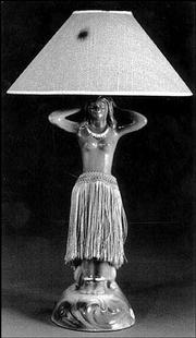 This kitsch lamp is a ceramic hula dancer from the 1950s. Her
rotating hips, fringed skirt and colorful glaze added up to a bid
of almost $550 at a David Rago auction of expensive '50s
furnishings.