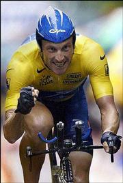 Lance Armstrong pumps his first after finishing third in the 19th
stage of the Tour de France. Armstrong secured his overall lead
Saturday, all but clinching his fifth straight Tour de France
title.