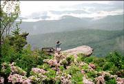 Hiker Maria Almond takes in the view of the Blue Ridge Mountains
from a trail off the Blue Ridge Parkway south of Blowing Rock, N.C.
The Parkway offers magnificent views of the Smoky and Blue Ridge
ranges.
