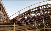 Visitors to Celebration City theme park in Branson, Mo., ride the
WildCat roller coaster. The WildCat is new this year and is one of
the few wooden coasters in the United States.