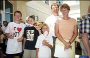 Members of the Taylor family enjoy cotton candy at the Lawrence
Memorial Hospital Old-Fashioned Community Picnic. From left, are,
Evan Taylor, 12; his friend Donald Phelps, 13; Chase Taylor, 8; and
Jim and Patti Taylor, all of Lawrence. They attended Sunday's event
at LMH South.