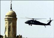 A U.S. Army blackhawk helicopter patrols over a market place in the
city of Tikrit, Iraq,. U.S. snipers killed two Iraqi men Friday and
wounded two others who were allegedly selling weapons in a market
in the center of Tikrit. U.S. forces positioned snipers around the
market after hearing that weapons and ammunition was sold at the
market place.