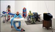 "Nursing Home," by French artist Gilles Barbier, includes wax
figures of ailing comic book characters, shown in this undated
publicity photo. The multimedia installation is among the works by
47 artist from 47 countries in the exhibit "The American Effect,"
running through Oct. 12 at the Whitney Museum of American Art in
New York.