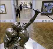 Hermon Atkins MacNeil&squot;s "The Sun Vow," modeled in 1898 and cast in
1901, commands a room at the Art Institute of Chicago&squot;s exhibit on
western art. The exhibition, titled "Windows on the West: Chicago
and the Art of the New Frontier, 1890-1940," is a look at the
pivotal role Chicago&squot;s philanthropists, railroaders and politicians
played in encouraging and subsidizing successive waves of
Southwestern artists.